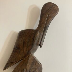 Hand carved vintage iron wood pelicans sculpture